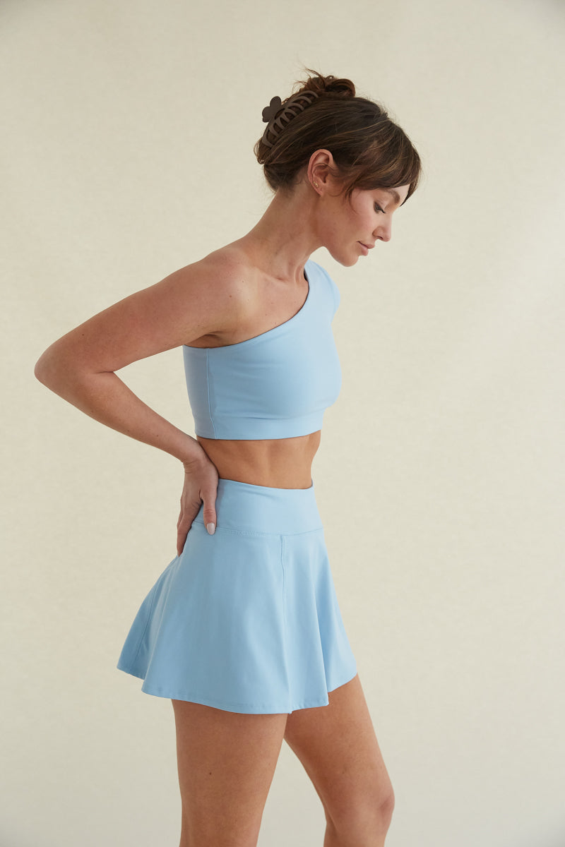 Avery Smoothing Flare Tennis Skort in Blue