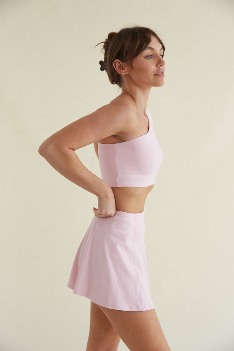 Avery Smoothing Flare Tennis Skort in Pink